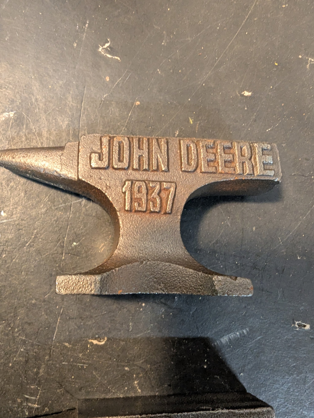 Seven  miniature advertising anvils