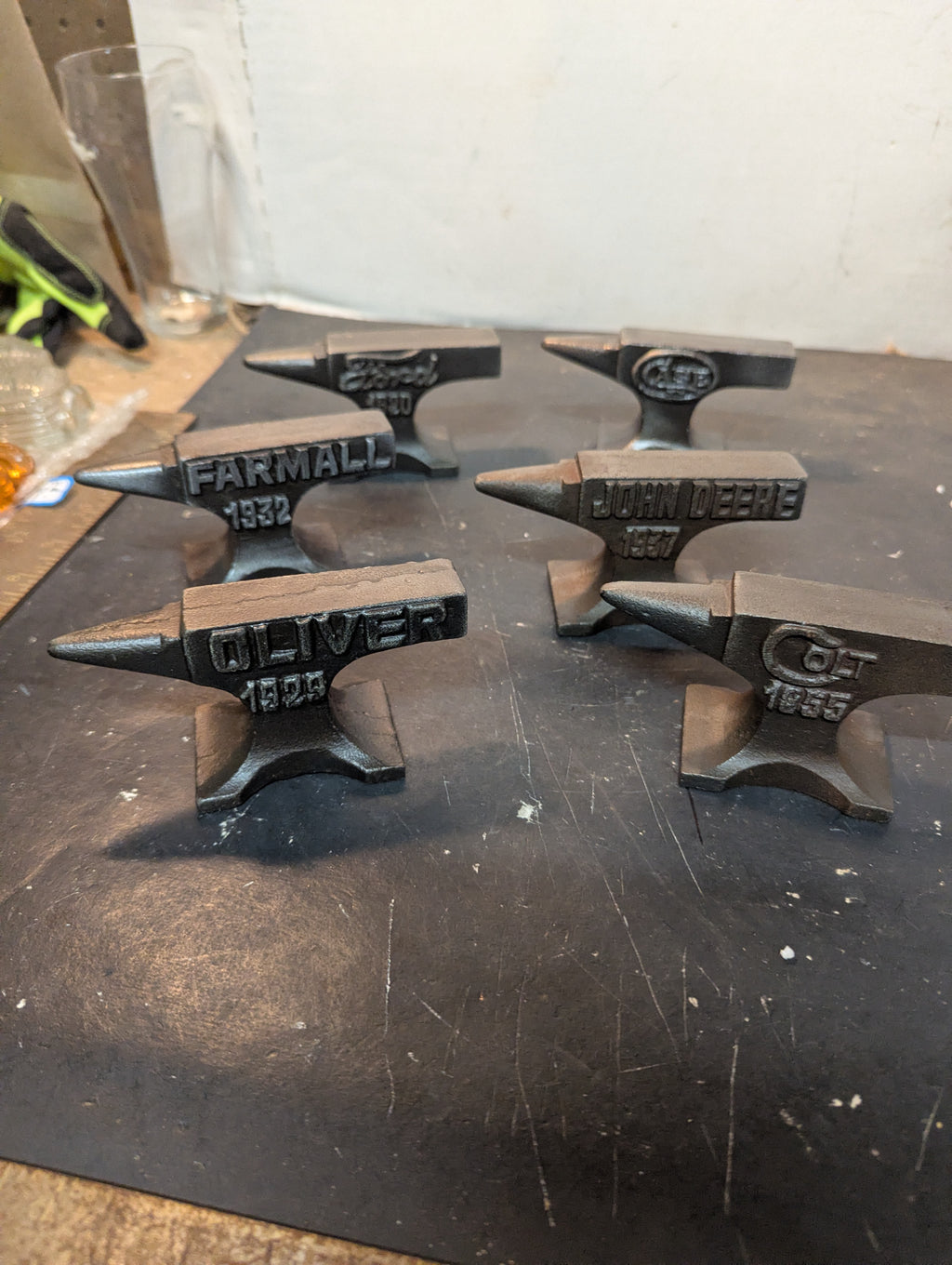 Six miniature steel anvils