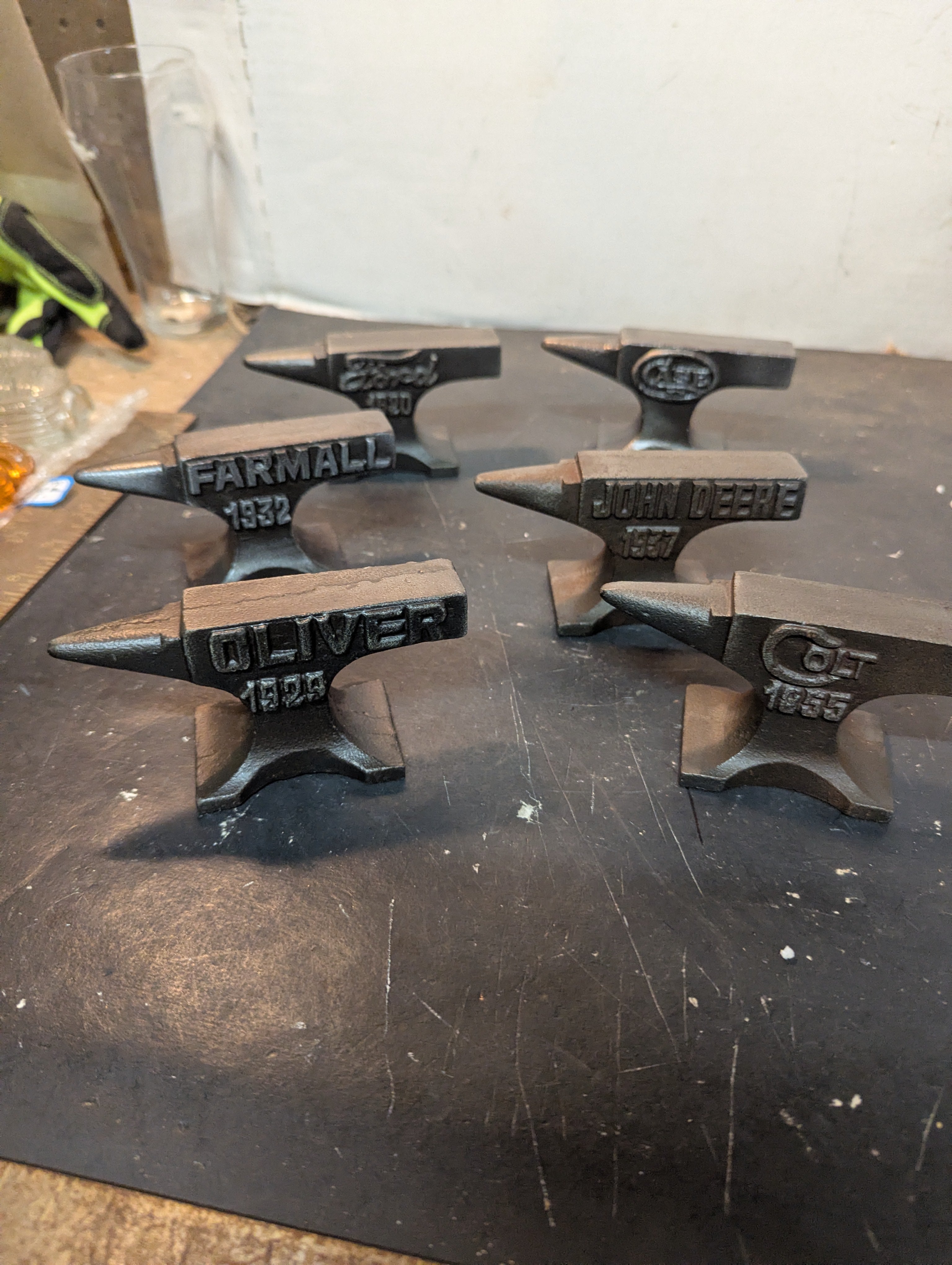 Six miniature steel anvils
