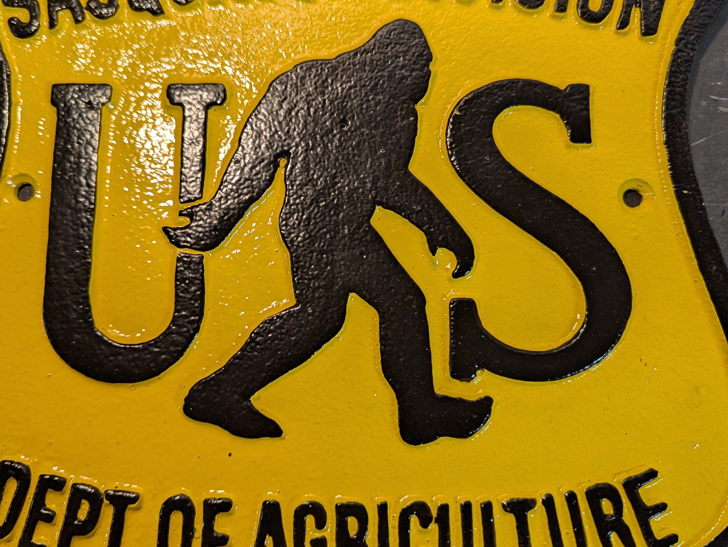 Sasquatch division cast iron sign
