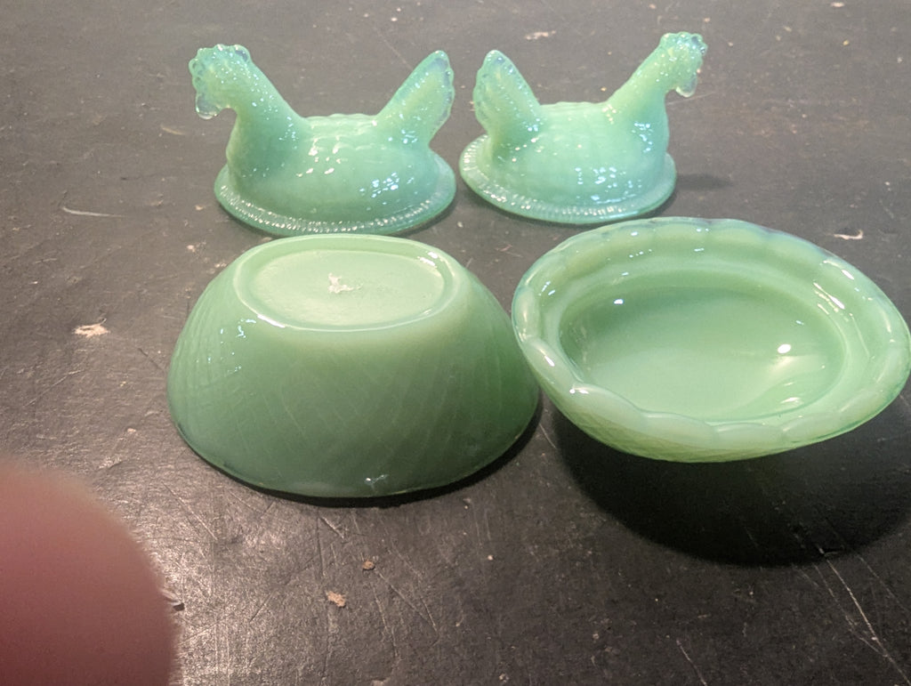 Pair of jadeite hens on nest