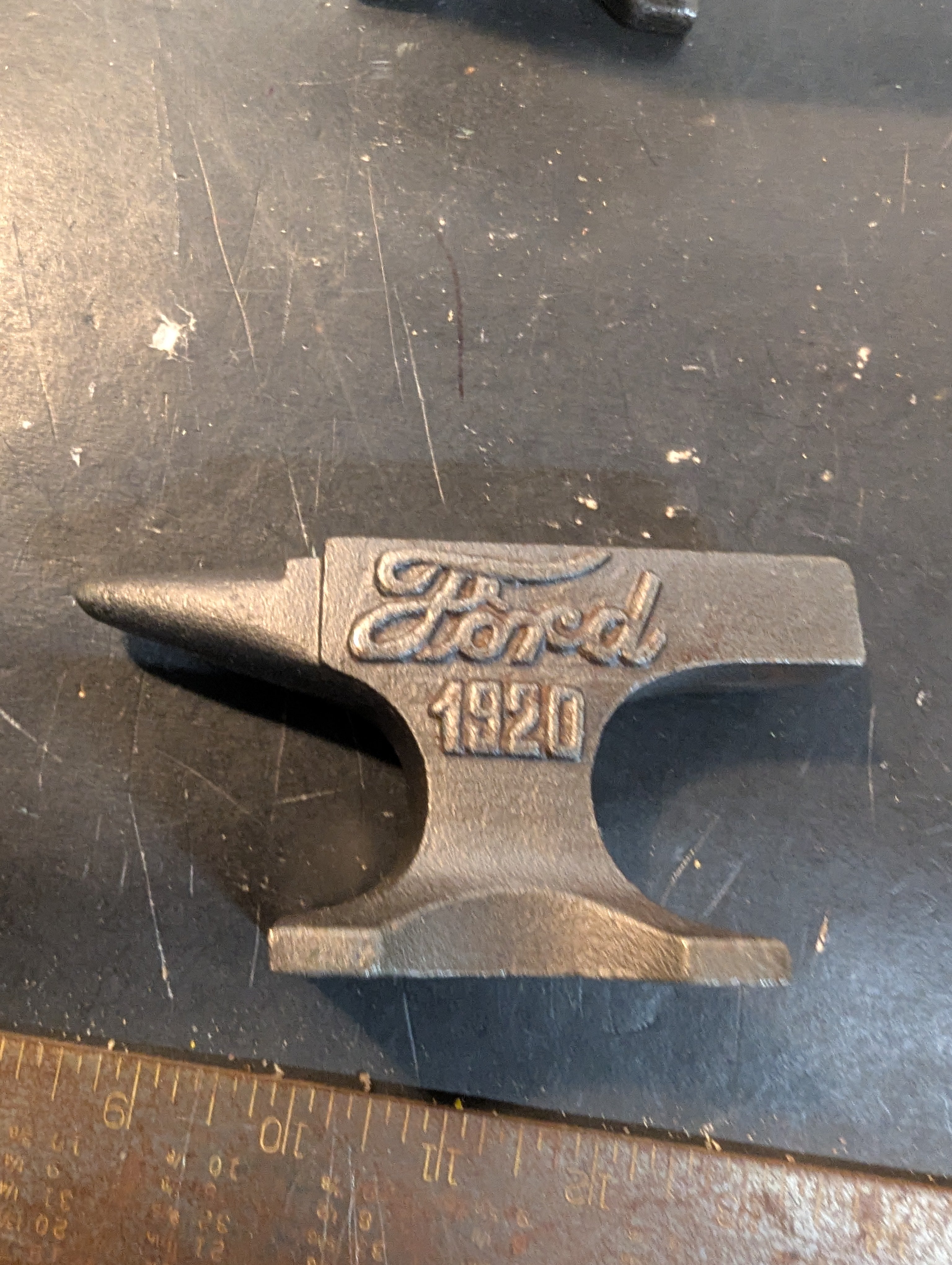 Seven  miniature advertising anvils