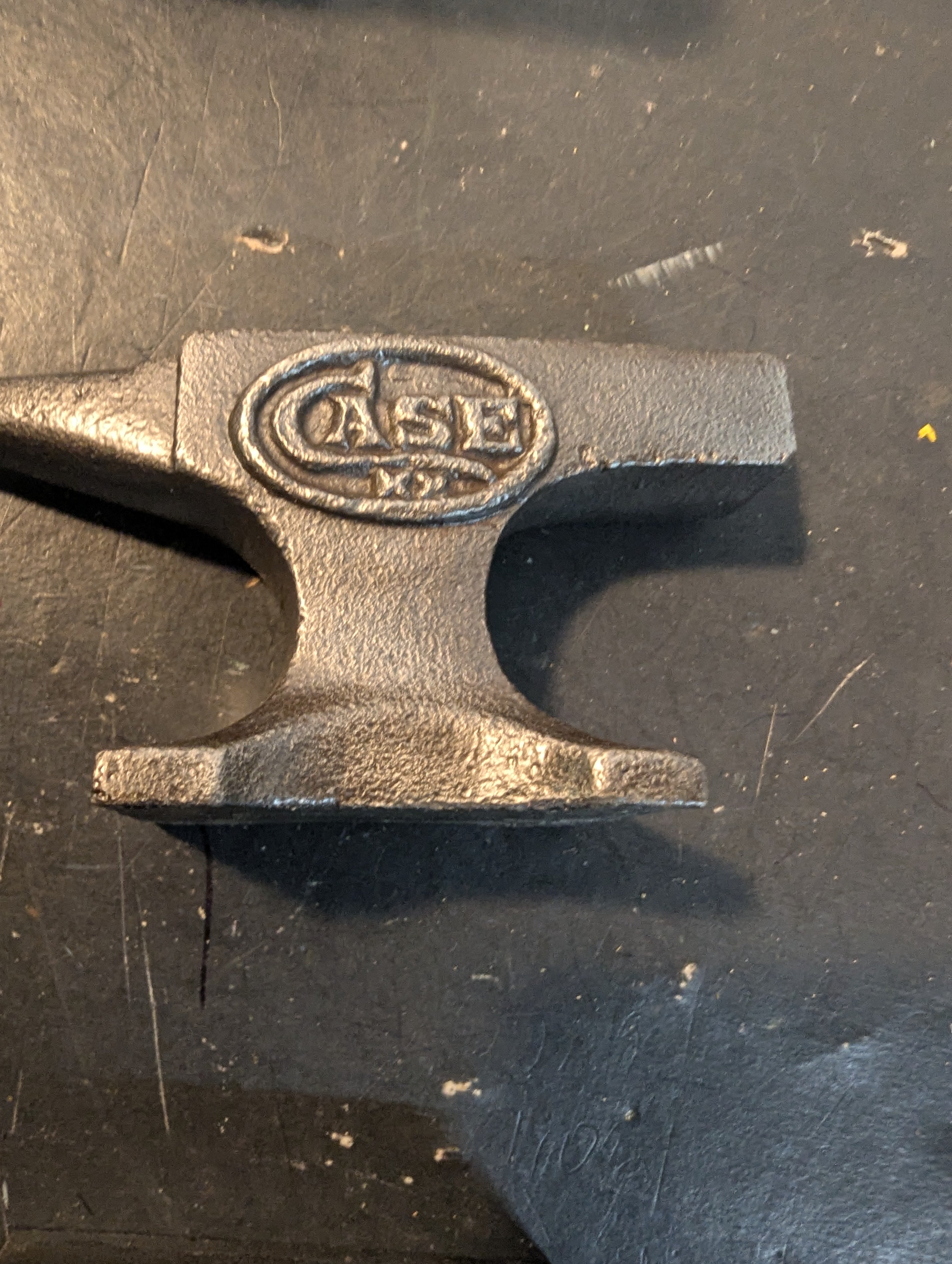 Seven  miniature advertising anvils