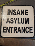 White large cast iron insane asylum entrance sign