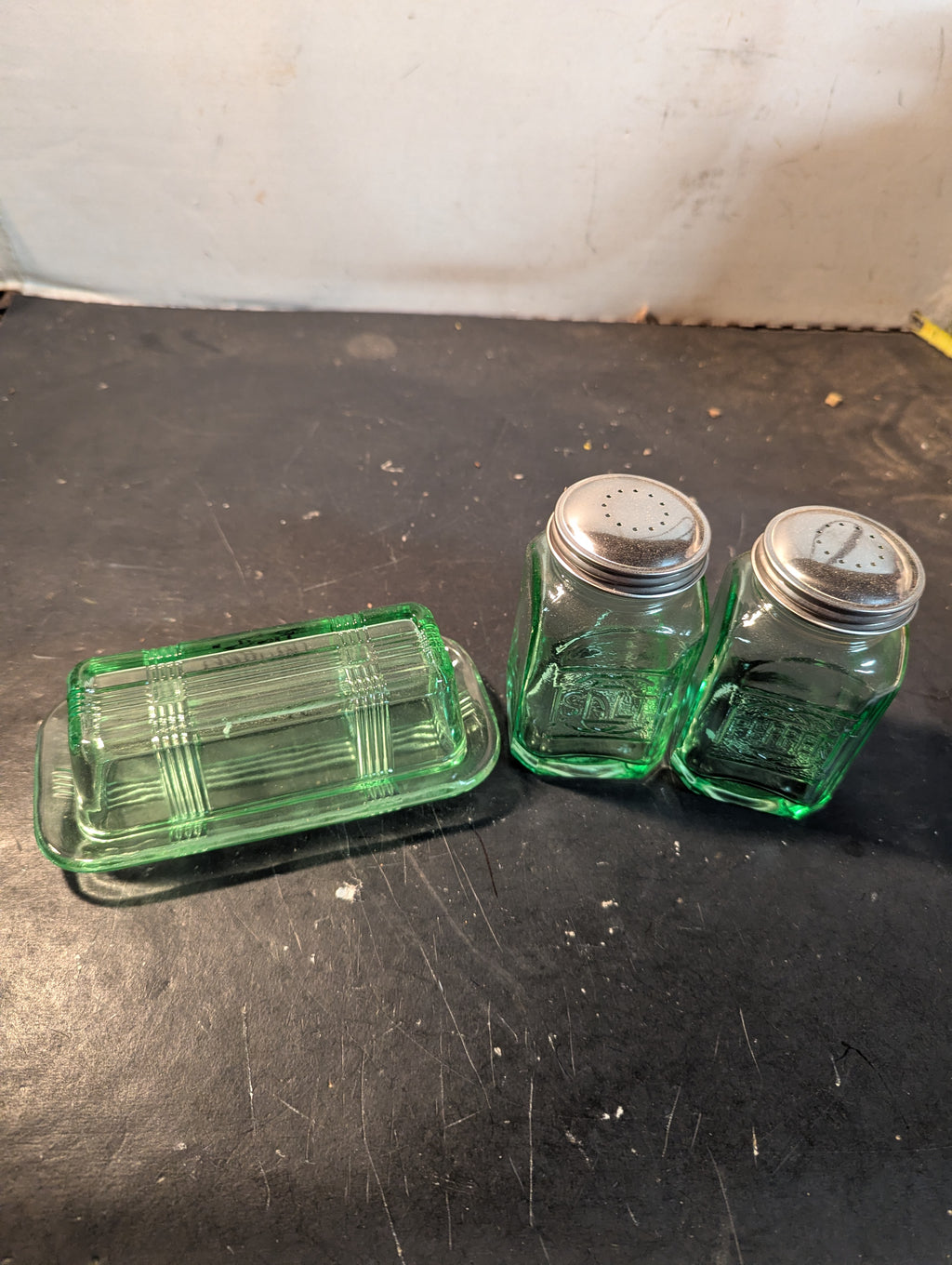 Green glass butter dish and salt and pepper shakers combo