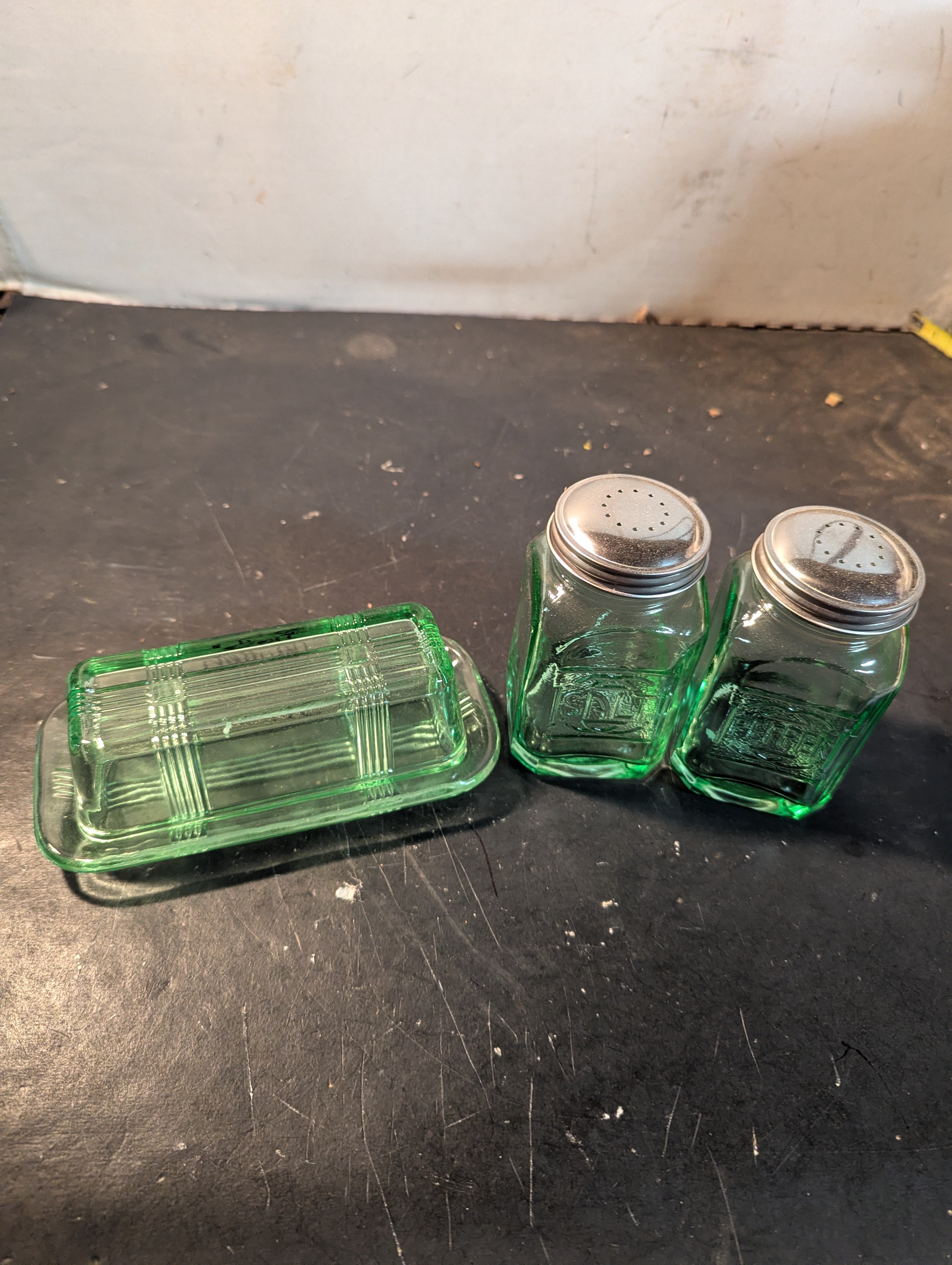 Green glass butter dish and salt and pepper shakers combo