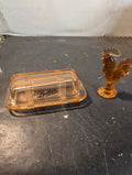 Pink glass rooster and a butter dish combo