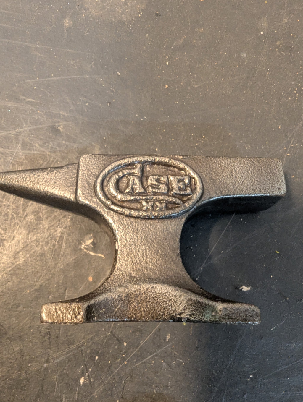Six miniature steel anvils