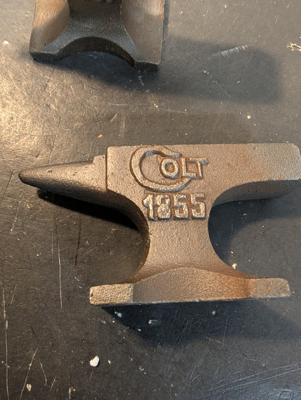 Six miniature steel anvils