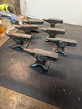 Seven  miniature advertising anvils