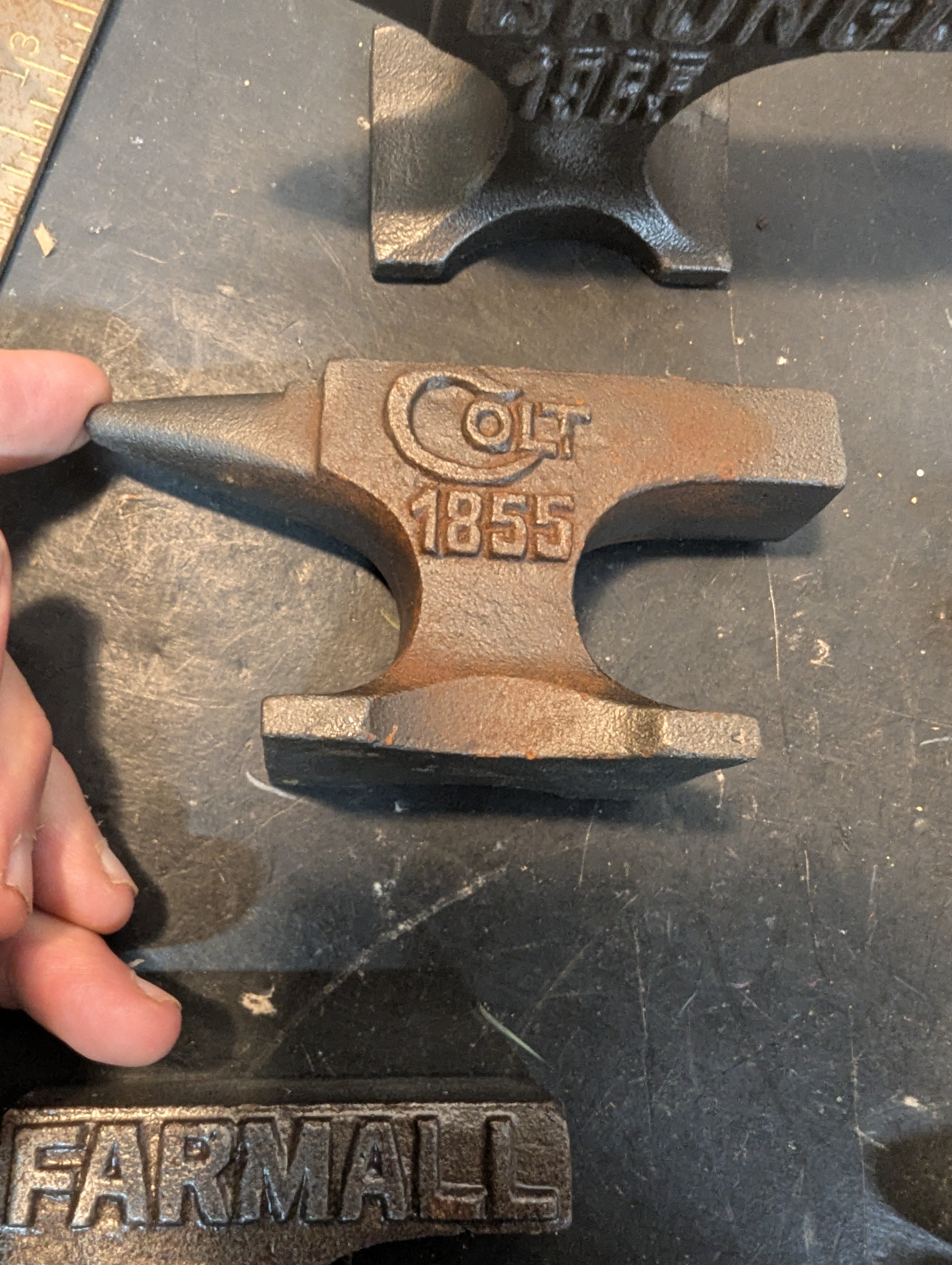 Seven  miniature advertising anvils