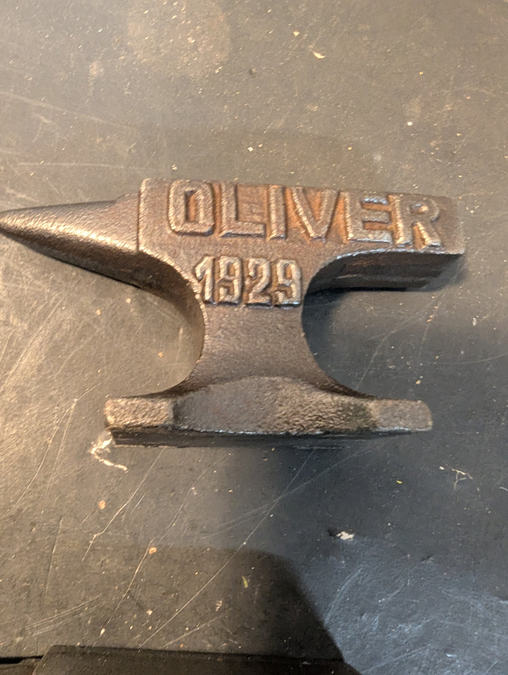 Seven  miniature advertising anvils