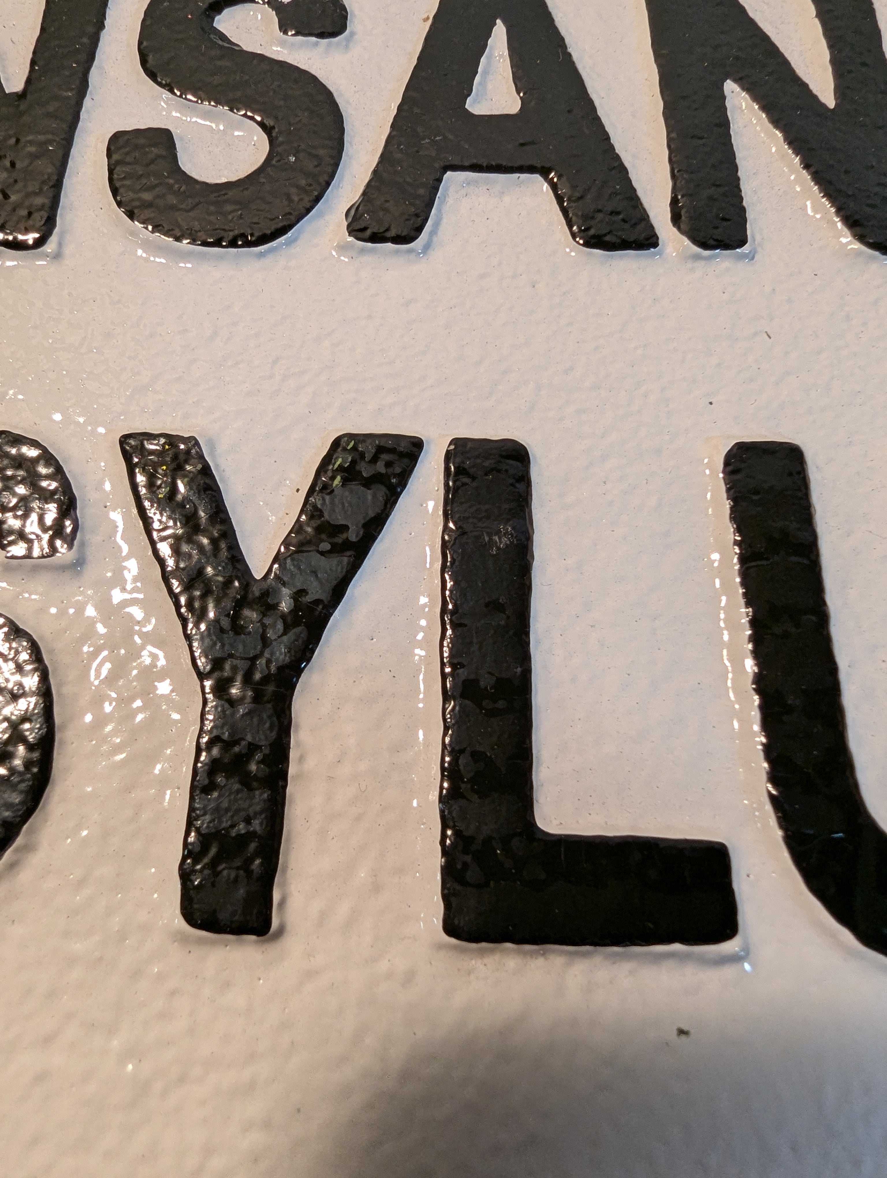 White large cast iron insane asylum entrance sign