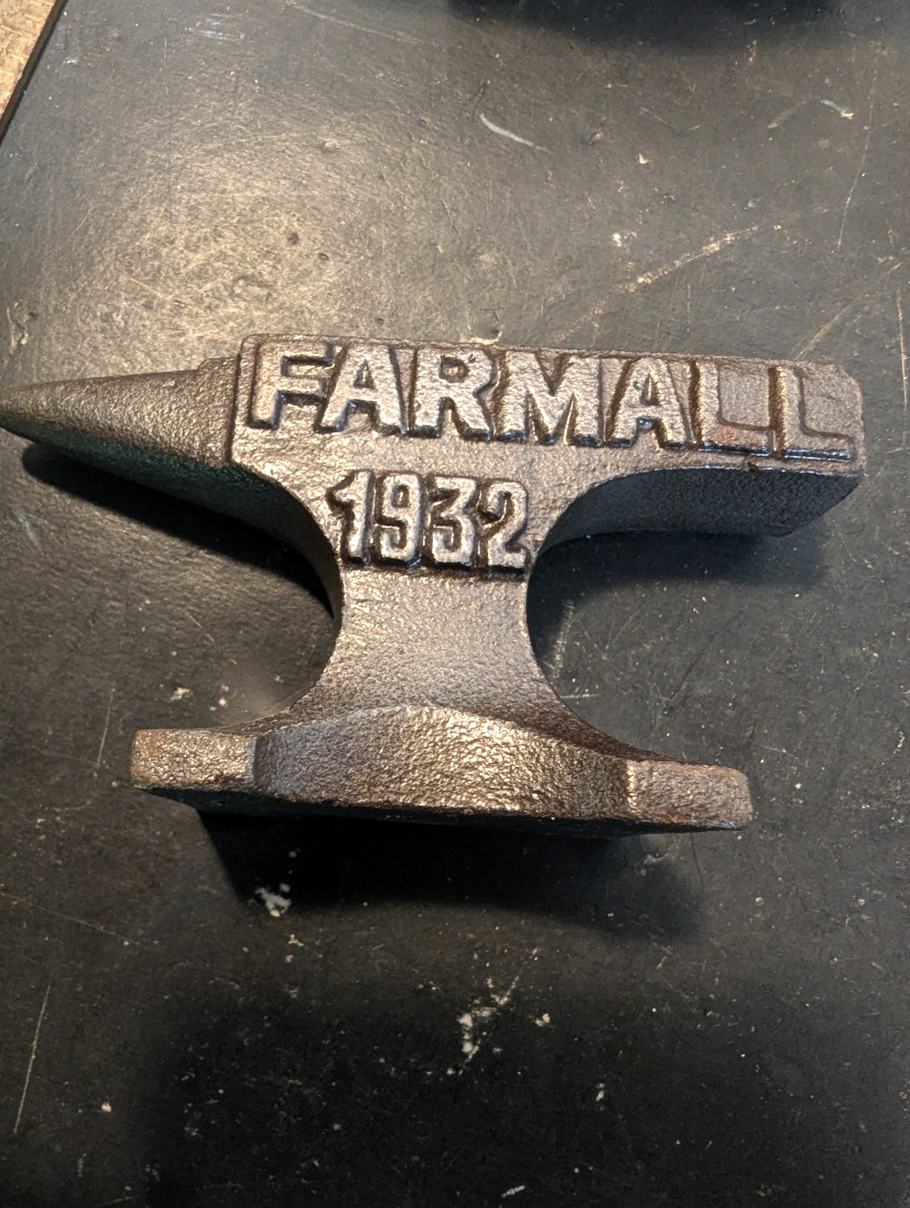 Seven  miniature advertising anvils